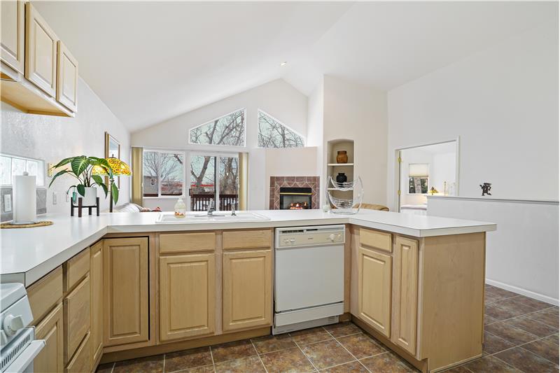 Kitchen with ceramic floor, open to family room