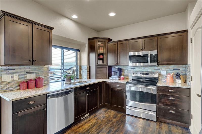 Stainless-steel appliances incl a dishwasher, smooth-top range oven, & new built-in microwave