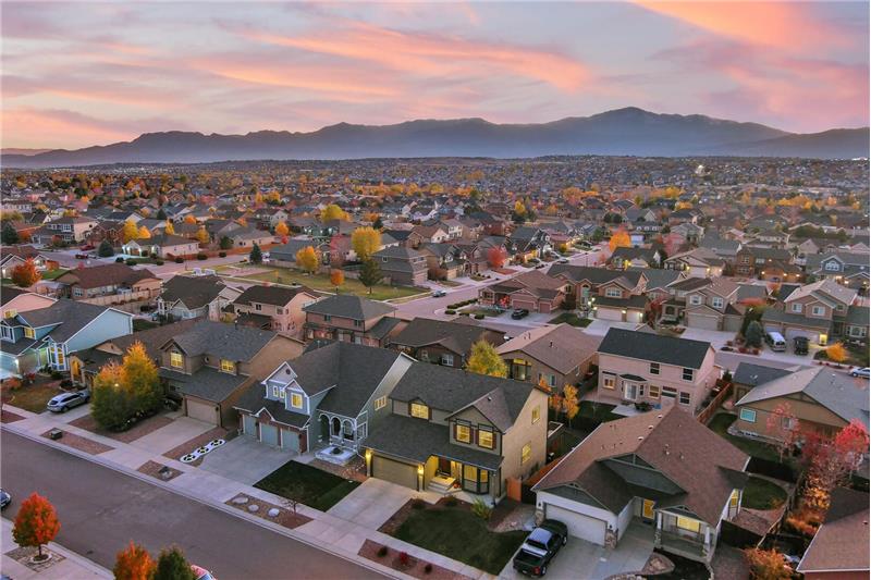 Sunset views of home, neighborhood, and mountain views