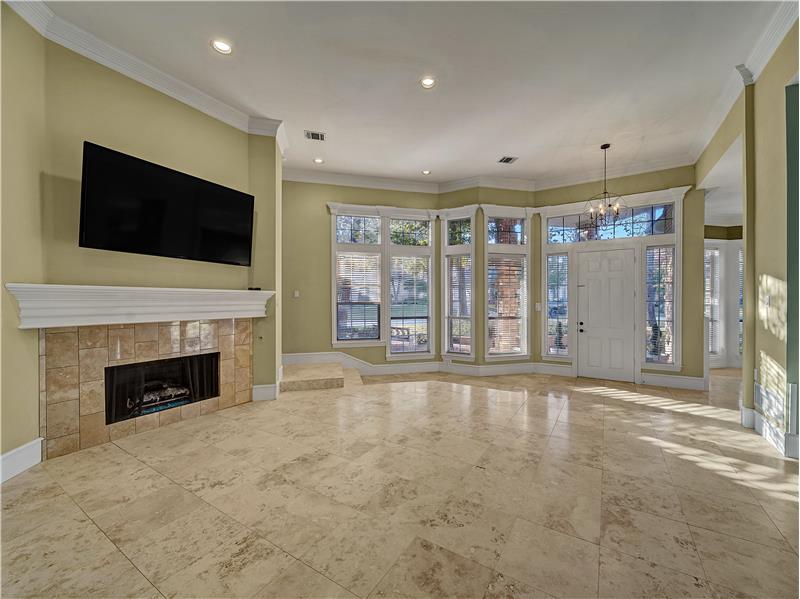 View of front living room area facing the entryway! This one story has so many windows that allows lots of natural light!