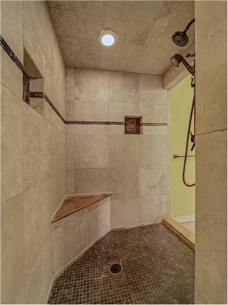 Primary Bathroom featuring this huge walk in shower!