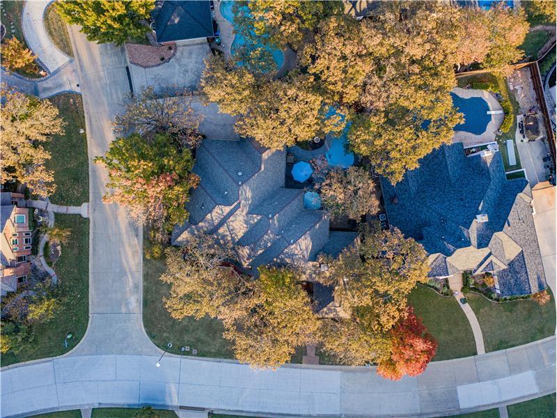 Drone / aerial top view of this home located very close to the lake and on a double Cul-De-Sac!