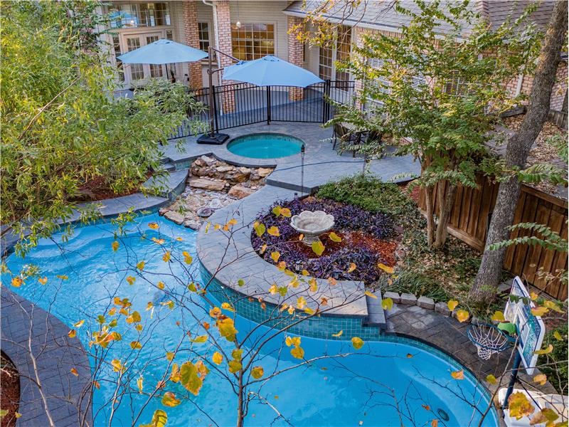 View of pool with jacuzzi, Water feature and patio!