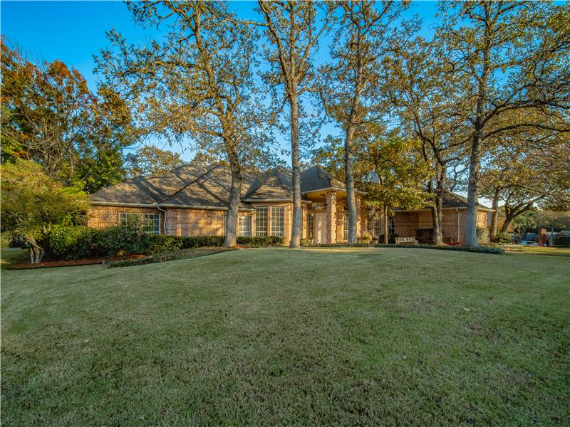 Immaculate yard and curb appeal galore!! Lots of mature trees on this beautiful lot viewed in the afternoon sunlight!