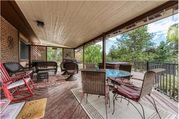 Covered deck off the Dining Nook for outdoor dining and relaxation.