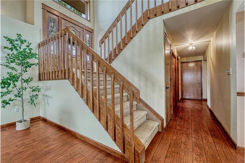 Curved stair case to the upper and main levels of the home.