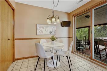 The Dining Nook is located off the Kitchen for informal dining & opens to the deck for comfortable indoor/outdoor dining & fun.