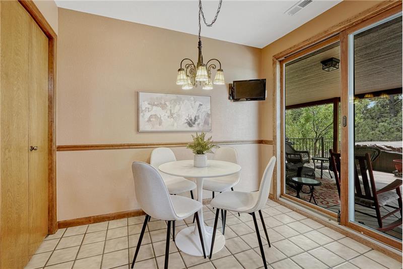 The Dining Nook is located off the Kitchen for informal dining & opens to the deck for comfortable indoor/outdoor dining & fun.