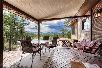 Covered Trex deck and expanded concrete patio with fabulous mountain views.