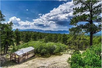 Glorious trees and mountain views with a greenhouse for growing your own food and flowers.