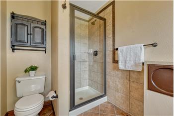 Tiled shower in the Primary Bathroom.