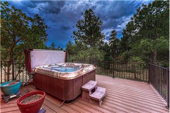 Sunset view of hot tub to enjoy after a long day's work.