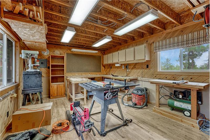 Powered and heated detached workshop with oak floors.