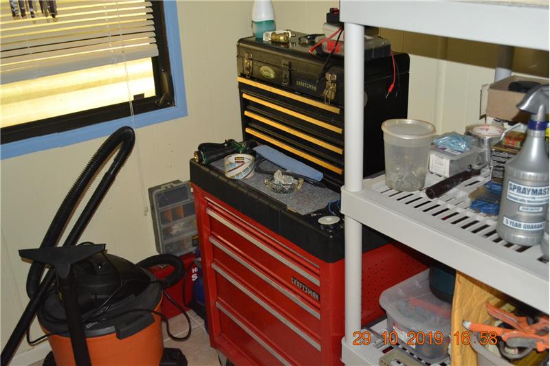small bedroom used as storage