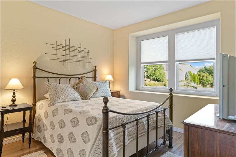 The other guest bedroom has view of the greenbelt.