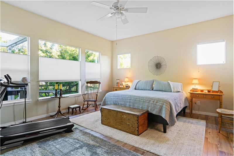 The primary suite has lots of natural light.