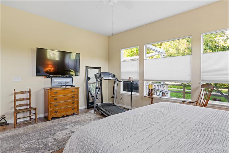 The wall-mounted TV in the primary suite is also included. The treadmill and most of the furniture is available for purchase.