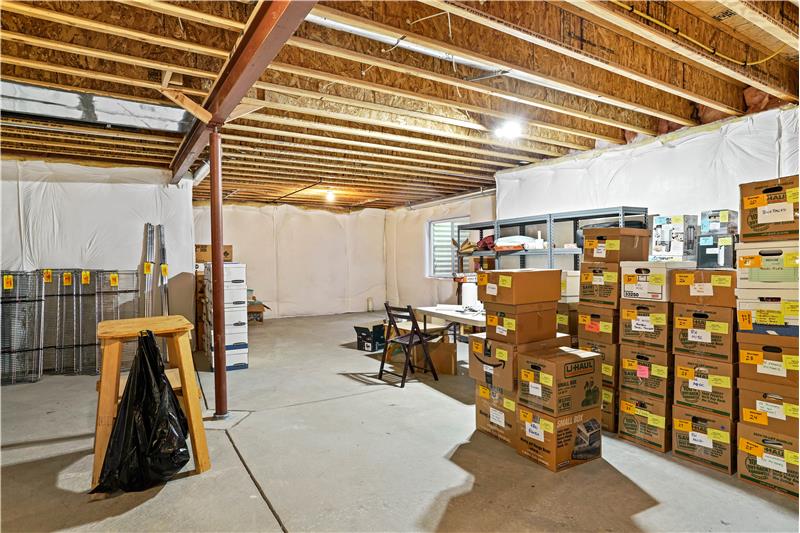 The unfinished basement has several egress windows.