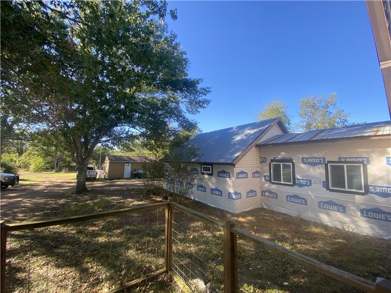 Carport conversion siding will be finished by close of escrow