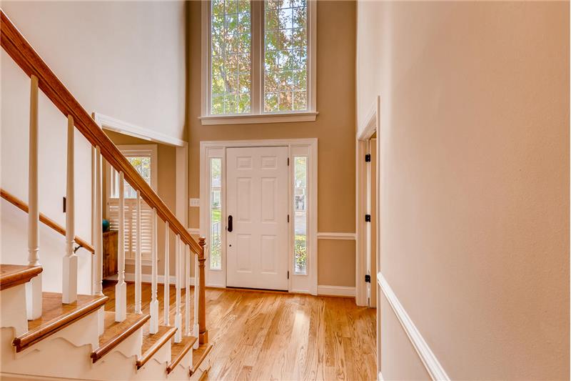 Sunny, 2-story foyer provides a lovely introduction to the home.