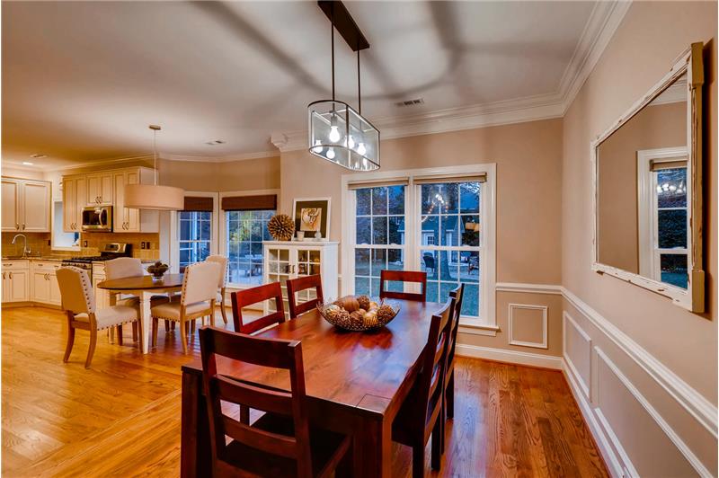 Gleaming hardwood floors, updated light fixture, crown molding and wainscoting.