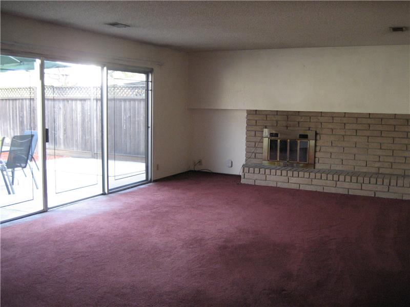 Large Family Room Leads to Backyard Patio 