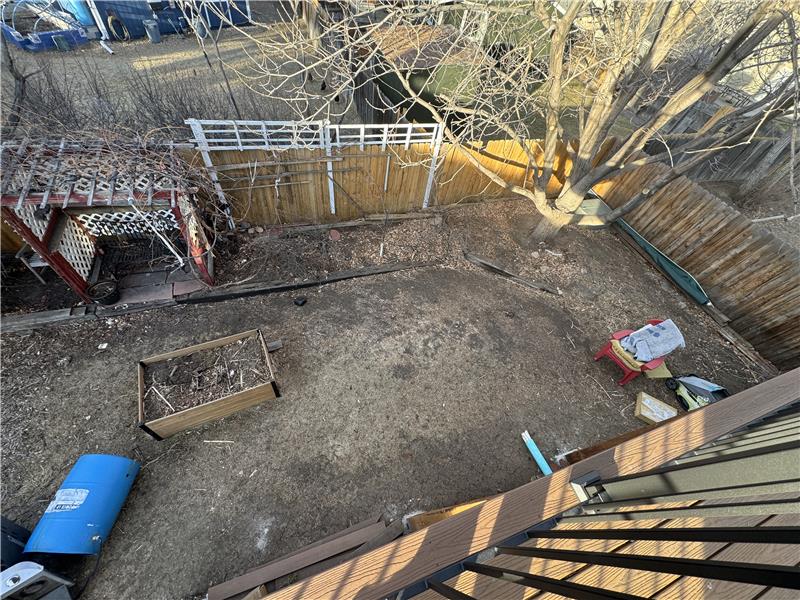 View of backyard from deck outside primary bedroom