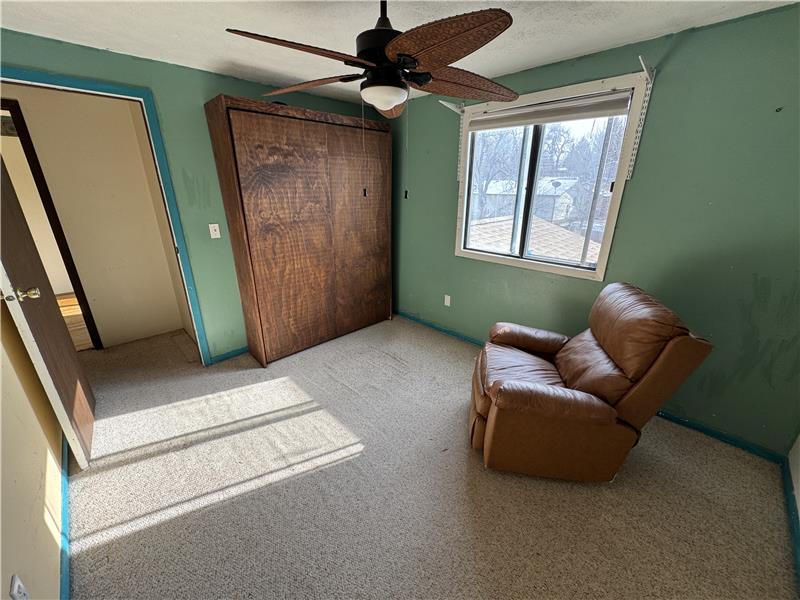 Reverse view of 2nd guest bedroom, showing included Murphy bed