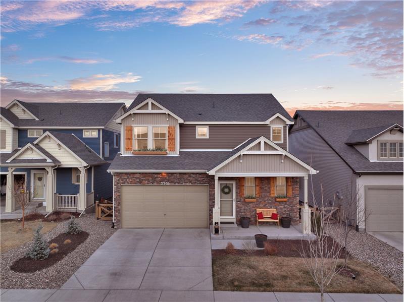 Aerial Front Views of this Beautiful Banning Lewis Ranch 2-Story Home with finished walk-out basement and covered front porch