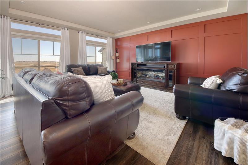 Light and Bright Great Room with Accent Wall and Plentiful Windows