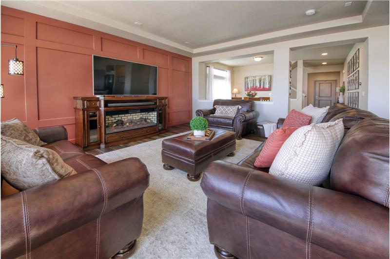 Light and Bright Great Room with Accent Wall and Gas Log Fireplace