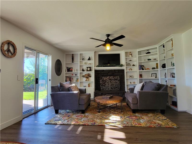 Family Room complete w/Wood Burning Fireplace Insert w/flue option vent that heats upstairs bedroom! Very Smart!!