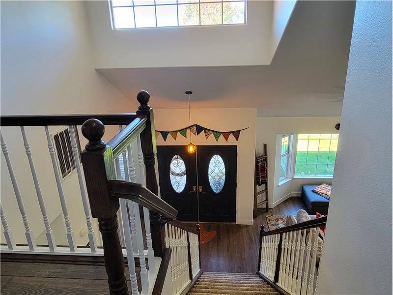 Solid Wood, Double Door Entry immediately reveals architectural lines of a Custom Home!