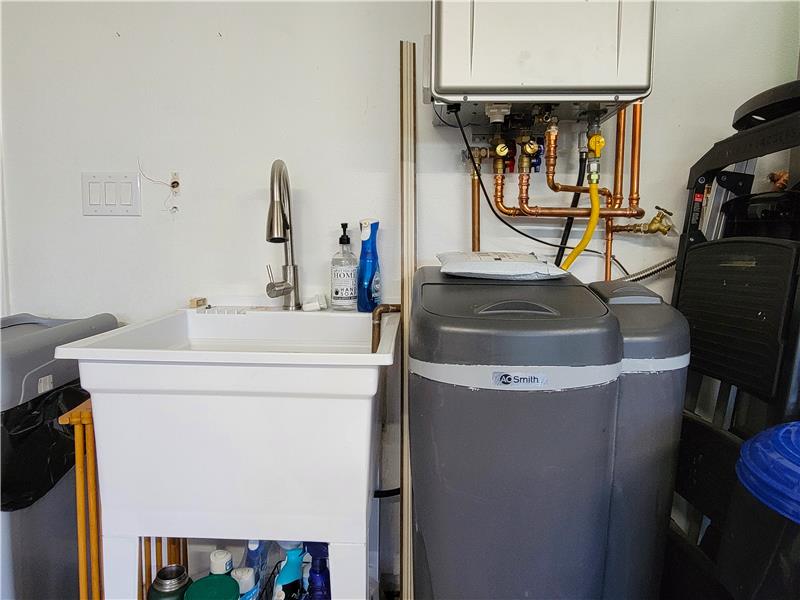 Convenience of Utility Sink as well as the A.O, Smith Water Softener w/Salt Sensing Technology & Self-Cleaning Filter!