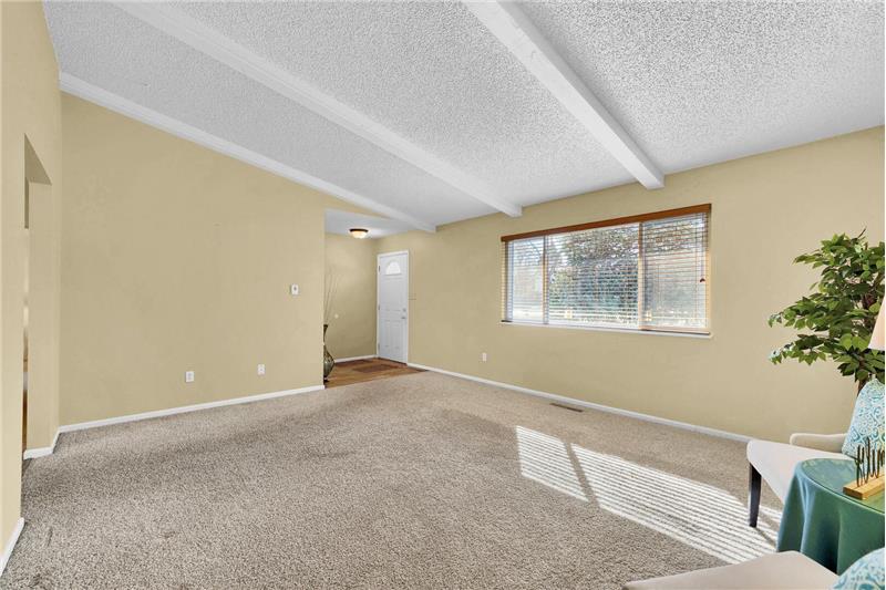 Front Entry with hickory laminate flooring into the formal Living Room.