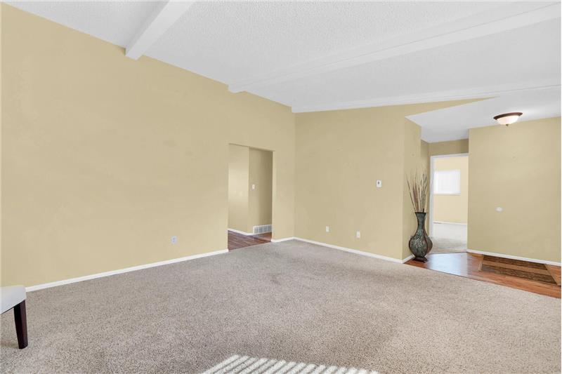 Formal Living Room with entry into Bedroom #2 and hallway to other Bedrooms.