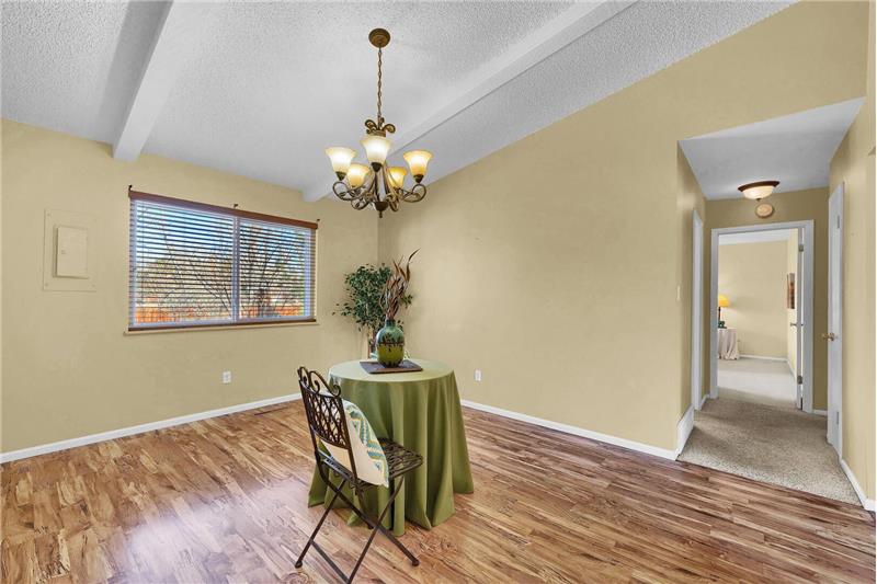 Formal Dining Room with view into the hallway and Master Bedroom.