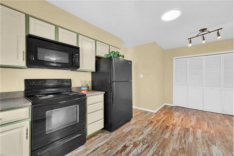 Kitchen into Dining Nook with Laundry closet.