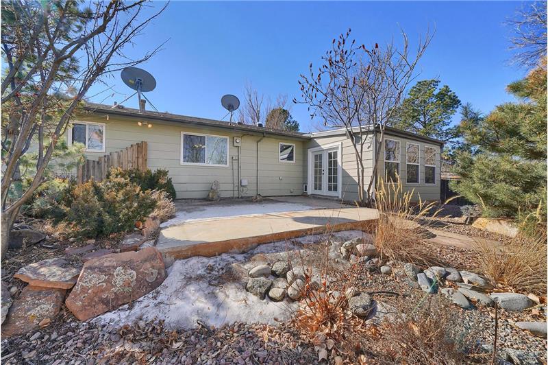 Low maintenance backyard with auto sprinklers, and mature trees and shrubs.