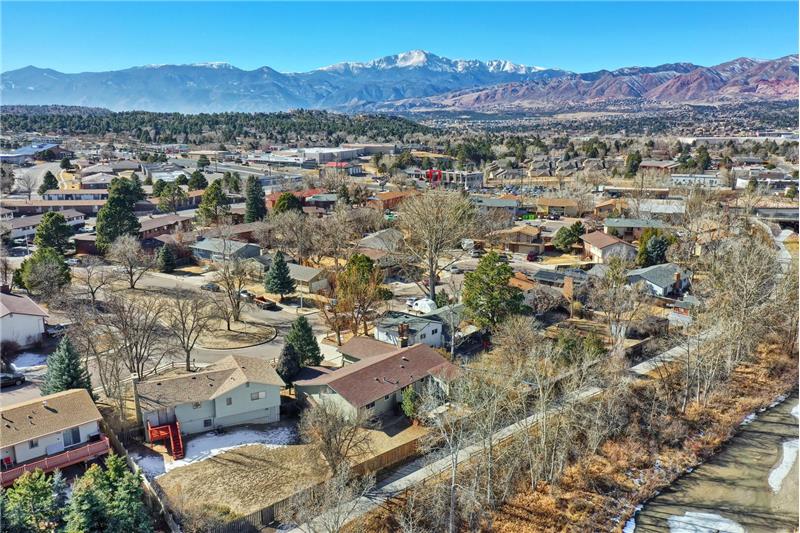 Another aerial view of the home and neighborhood.