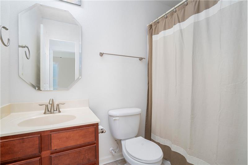 Full bathroom on the main floor features tub/shower combination, ceramic tile floor.