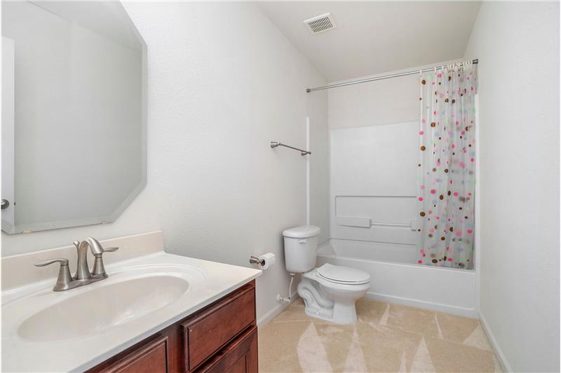 Bathroom shared by the two secondary bedrooms on the home's upper floor.