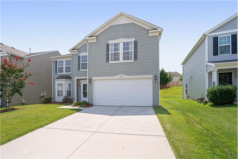 2- car garage provides excellent parking and storage space. More parking in the driveway.