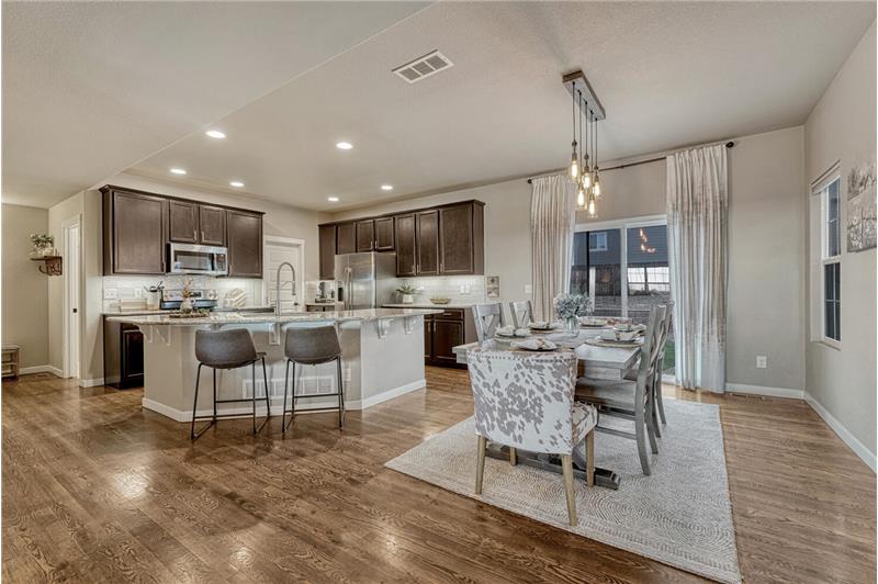 Dining Area and Kitchen with slider to the backyard patio.