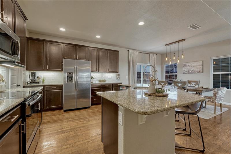 View of the Island Kitchen and Dining Area.