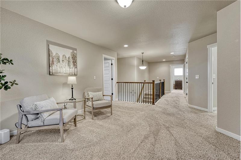 View of the Loft and entry into the upper level Bedrooms.