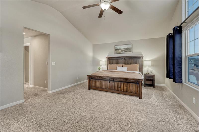 The Primary Suite has a sitting area, a lighted ceiling fan, a walk in closet, and adjoining spa-like 5pc Bathroom.