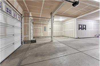 Lots of room in the 4-car attached garage for cars, tools, and toys.