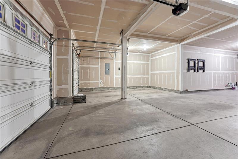 Lots of room in the 4-car attached garage for cars, tools, and toys.