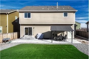 Low maintenance, fenced backyard with expanded patio and gazebo for outdoor relaxation and fun.